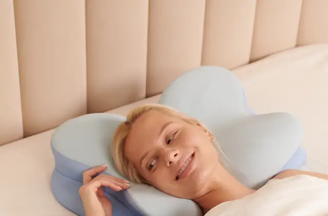 Woman resting her hand beside the butterfly pillow